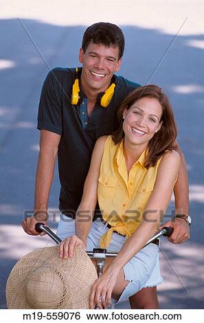 couple on a bicycle View Large Photo Image Stock Photograph - couple on a bicycle. Fotosearch