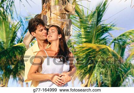 Couple on a caribbean beach View Large Photo Image Stock Photo - Couple on a caribbean beach. Fotosearch