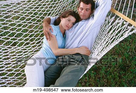 couple on a hammock View Large Photo Image Stock Photo - couple on a hammock. Fotosearch