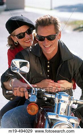 Stock Photo - couple on a motorcycle. Fotosearch