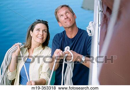 couple on a sailboat View Large Photo Image Stock Photo - couple on a sailboat. Fotosearch