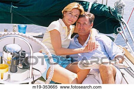Couple on a sailboat View Large Photo Image Stock Photography - Couple on a sailboat. Fotosearch
