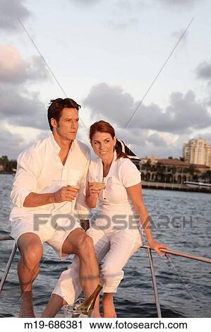 Couple on a sunset cruise View Large Photo Image Stock Image - Couple on a sunset cruise. Fotosearch