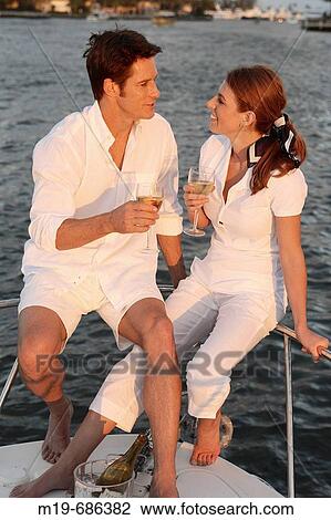 Couple on a sunset cruise View Large Photo Image Stock Image - Couple on a sunset cruise. Fotosearch