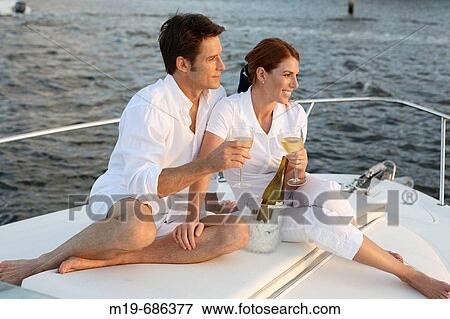 Couple on a sunset cruise View Large Photo Image Stock Photo - Couple on a sunset cruise. Fotosearch