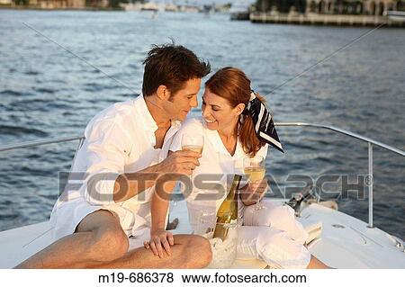 Couple on a sunset cruise View Large Photo Image Stock Photo - Couple on a sunset cruise. Fotosearch
