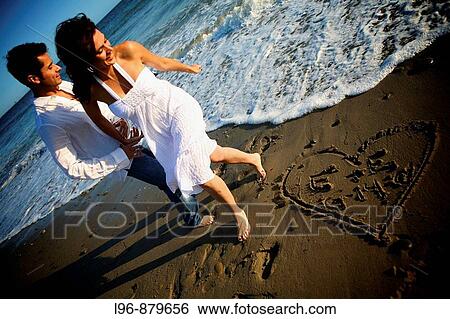 Couple on Beach View Large Photo Image Stock Photograph - Couple on Beach. Fotosearch