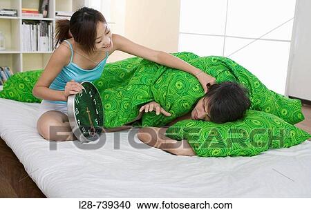 Stock Image - couple on bed. Fotosearch