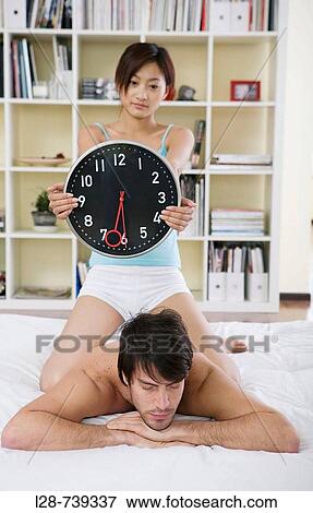 Stock Photo - couple on bed. Fotosearch