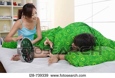 Stock Photo - couple on bed. Fotosearch