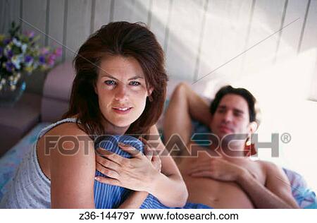 Couple on bed View Large Photo Image Stock Photo - Couple on bed. Fotosearch