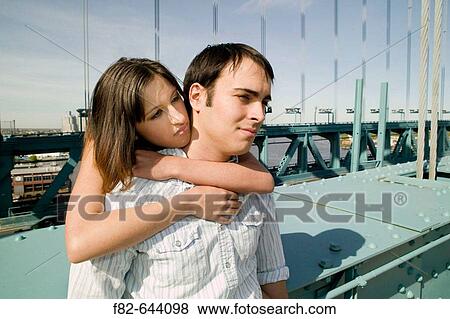 Stock Photo - Couple on Benjamin Franklin Bridge. Philadelphia. Pennsylvania. USA.. Fotosearch