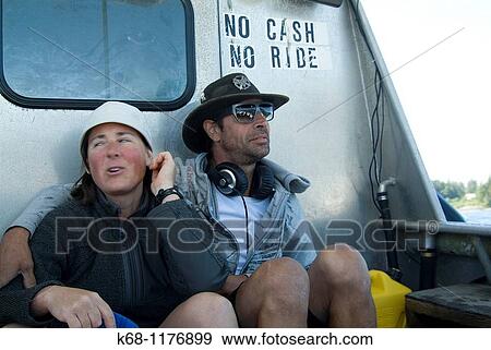 couple on boat trip from Flores Island to Tofino, West Coast, Vancouver Island, British Columbia, Canada View Large Photo Image Stock Photo - couple on boat trip from Flores Island to Tofino, West Coast, Vancouver Island, British Columbia, Canada. Fotosearch