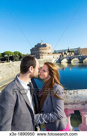 Couple on bridge Ponte Vittorio Emanuele in front of Castel sant? Angelo Rome Italy View Large Photo Image Stock Image - Couple on bridge Ponte Vittorio Emanuele in front of Castel sant? Angelo Rome Italy. Fotosearch