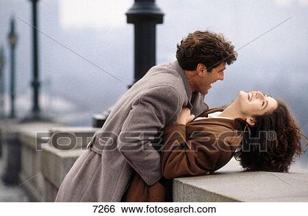 Couple on bridge View Large Photo Image Stock Photograph - Couple on bridge. Fotosearch