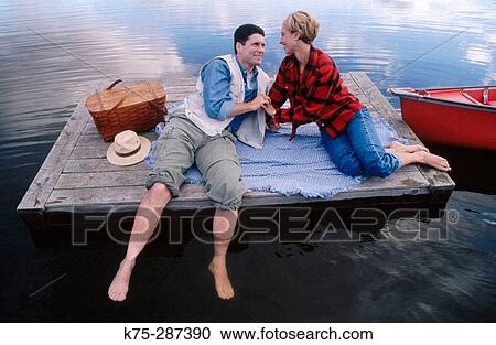 couple on dock in lake View Large Photo Image Stock Image - couple on dock in lake. Fotosearch