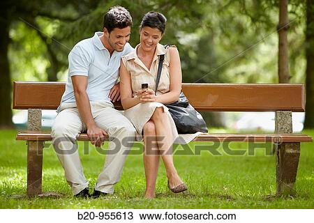 Couple on garden bench, spa-relais. Lierganes hotel and spa, Cantabria, Spain View Large Photo Image Stock Image - Couple on garden bench, spa-relais. Lierganes hotel and spa, Cantabria, Spain. Fotosearch