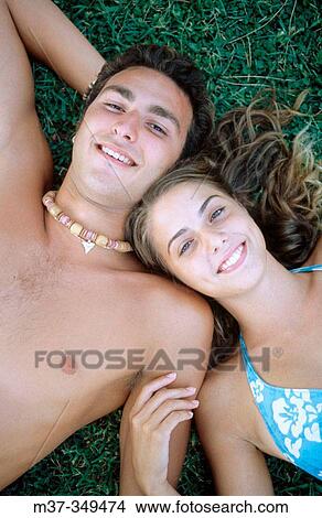 Couple on grass. View Large Photo Image Picture - Couple on grass.. Fotosearch