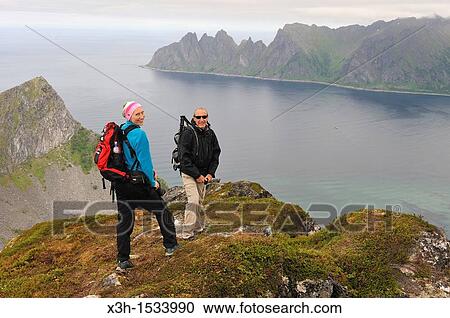 couple on Husfjellet mountain, Senja island County of Troms, Norway, Northern Europe View Large Photo Image Stock Image - couple on Husfjellet mountain, Senja island County of Troms, Norway, Northern Europe. Fotosearch