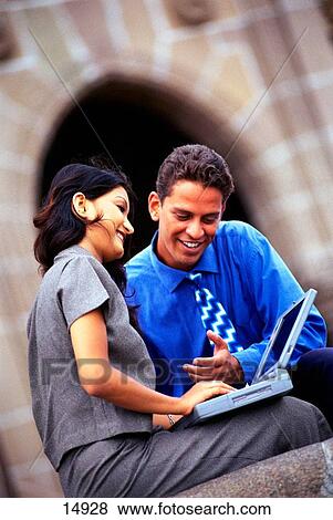 Stock Photo - Couple on laptop. Fotosearch