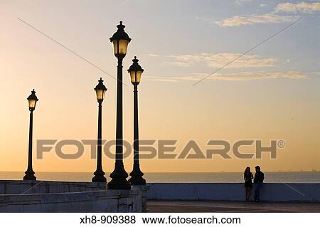 Couple on Las Bovedas Promenade at sunset, Casco Viejo, Panama City, Panama View Large Photo Image Stock Photo - Couple on Las Bovedas Promenade at sunset, Casco Viejo, Panama City, Panama. Fotosearch