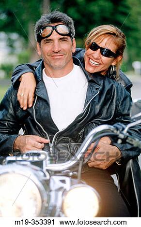 Couple on motorbike View Large Photo Image Stock Image - Couple on motorbike. Fotosearch