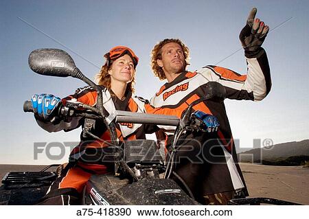 Stock Image - Couple on quad. Fotosearch