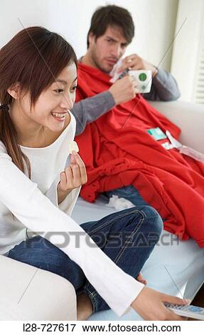 Couple on sofa View Large Photo Image Stock Photo - Couple on sofa. Fotosearch