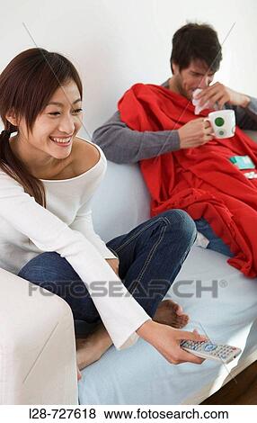 Couple on sofa View Large Photo Image Stock Photo - Couple on sofa. Fotosearch