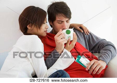 Stock Photograph - Couple on sofa. Fotosearch