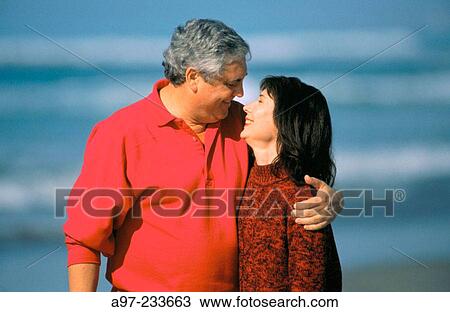Couple on the beach View Large Photo Image Stock Image - Couple on the beach. Fotosearch