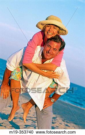 Couple on the beach View Large Photo Image Stock Image - Couple on the beach. Fotosearch