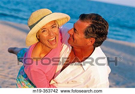 Couple on the beach View Large Photo Image Stock Image - Couple on the beach. Fotosearch