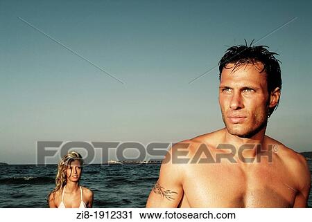 Stock Image - Couple on the beach. Fotosearch