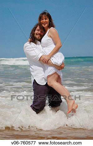 Stock Photo - Couple on the beach. Fotosearch