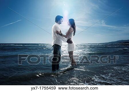Couple on the beach View Large Photo Image Stock Photo - Couple on the beach. Fotosearch