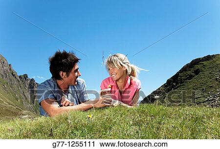 Couple on the mountain. Italy, Piedmont Alps, Formazza Valley. View Large Photo Image Stock Image - Couple on the mountain. Italy, Piedmont Alps, Formazza Valley.. Fotosearch
