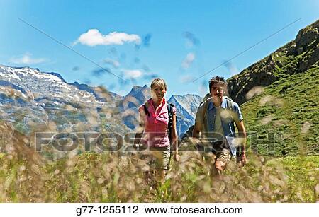 Couple on the mountain. Italy, Piedmont Alps, Formazza Valley. View Large Photo Image Stock Image - Couple on the mountain. Italy, Piedmont Alps, Formazza Valley.. Fotosearch