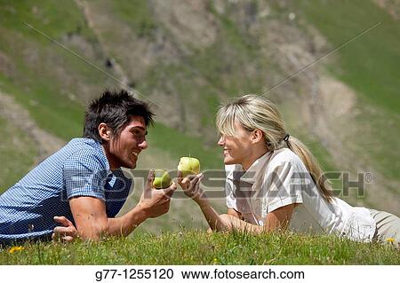 Couple on the mountain. Italy, Piedmont Alps, Formazza Valley. View Large Photo Image Stock Image - Couple on the mountain. Italy, Piedmont Alps, Formazza Valley.. Fotosearch