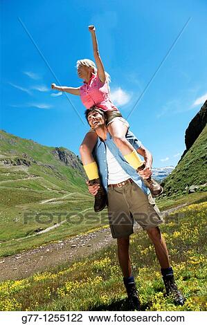 Couple on the mountain. Italy, Piedmont Alps, Formazza Valley. View Large Photo Image Stock Image - Couple on the mountain. Italy, Piedmont Alps, Formazza Valley.. Fotosearch