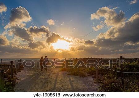 Couple on Venice Beach in Venice Florida at sunset View Large Photo Image Stock Photo - Couple on Venice Beach in Venice Florida at sunset. Fotosearch