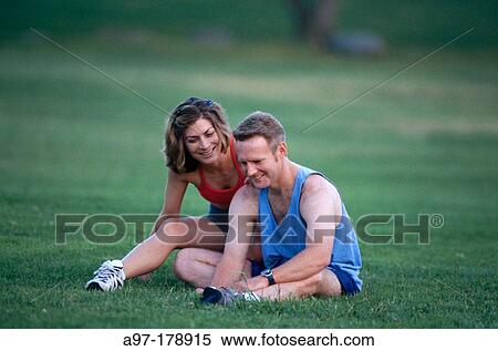 Stock Photography - Couple outdoors exercising. Fotosearch