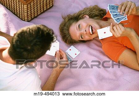 couple playing cards on a blanket View Large Photo Image Stock Image - couple playing cards on a blanket. Fotosearch