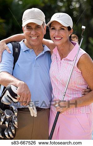 Stock Photograph - Couple playing golf. Fotosearch