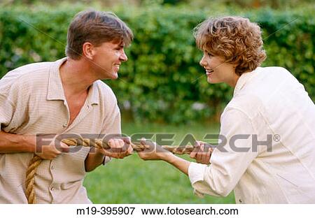couple playing? tug of war? View Large Photo Image Stock Photo - couple playing? tug of war?. Fotosearch
