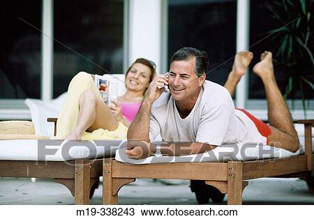couple poolside View Large Photo Image Stock Image - couple poolside. Fotosearch