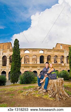 Couple posing in front of the Roman Colosseum View Large Photo Image Stock Image - Couple posing in front of the Roman Colosseum. Fotosearch
