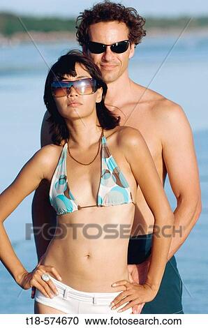 Stock Image - couple posing on beach. Fotosearch