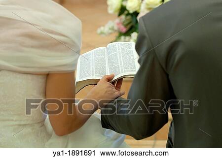 Couple reading together Bible during Christian wedding ceremony, Firenze, Tuscany, Italy View Large Photo Image Stock Image - Couple reading together Bible during Christian wedding ceremony, Firenze, Tuscany, Italy. Fotosearch