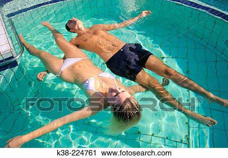 Couple relaxing in pool View Large Photo Image Stock Image - Couple relaxing in pool. Fotosearch